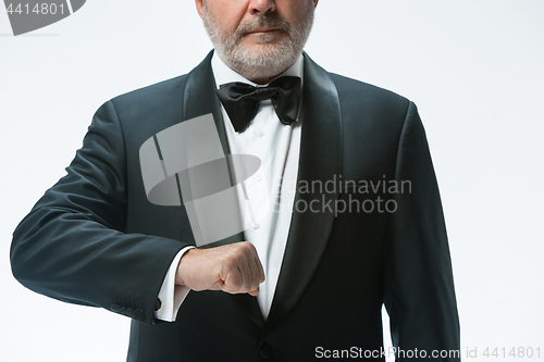 Image of Senior waiter with white towel. Sign language in the restaurant