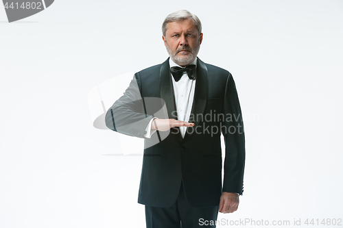 Image of Senior waiter with white towel. Sign language in the restaurant