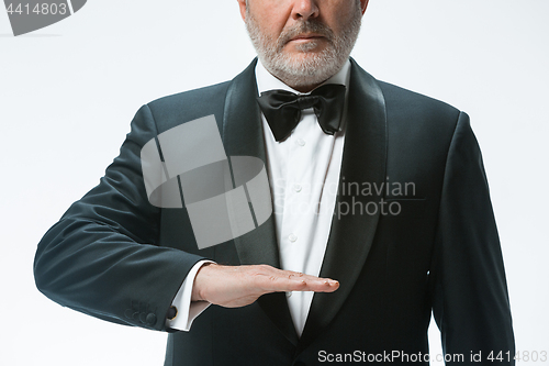 Image of Senior waiter with white towel. Sign language in the restaurant