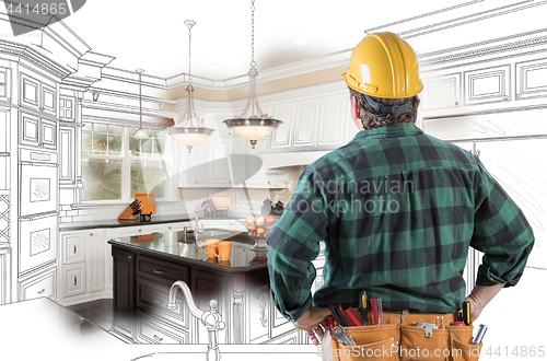 Image of Male Contractor with Hard Hat and Tool Belt Looking At Custom Ki