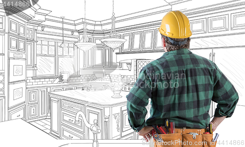 Image of Male Contractor with Hard Hat and Tool Belt Looking At Custom Ki