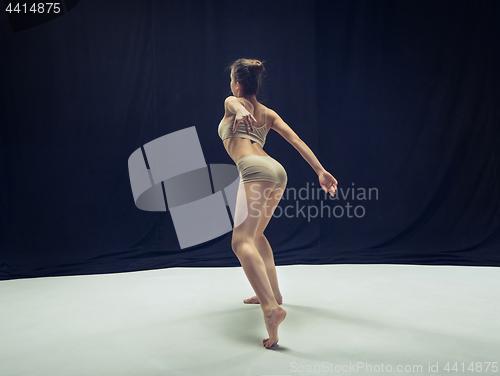 Image of Young teen dancer ion white floor background.