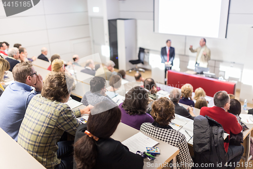 Image of Business speaker giving a talk at business conference event.