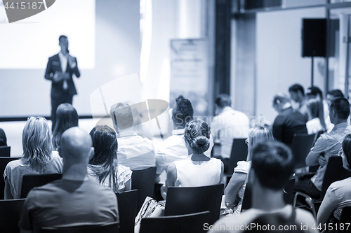 Image of Business speaker giving a talk at business conference event.