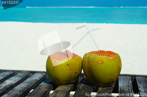 Image of Tropical coconut on white beach