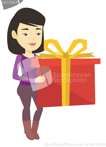 Image of Joyful asian woman holding box with gift.