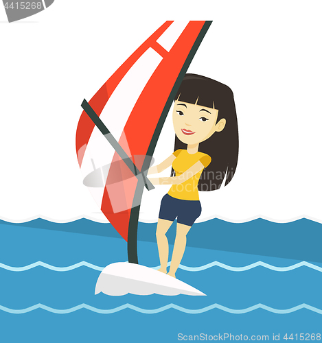 Image of Young woman windsurfing in the sea.