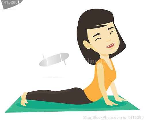 Image of Woman practicing yoga upward dog pose.