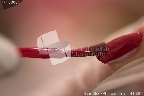 Image of Woman hands receiving a manicure