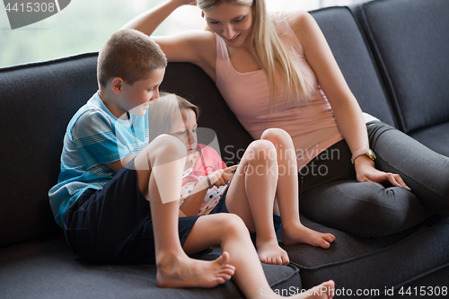 Image of young mother spending time with kids