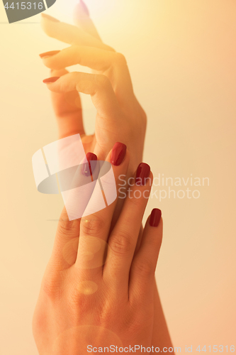 Image of closeup of hands of a young woman