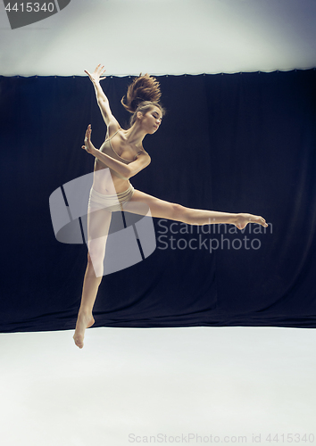 Image of Young teen dancer ion white floor background.