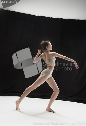 Image of Young teen dancer on white floor background.