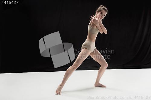 Image of Young teen dancer on white floor background.
