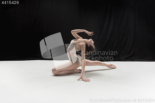 Image of Young teen dancer on white floor background.