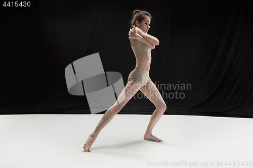 Image of Young teen dancer on white floor background.