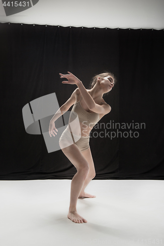 Image of Young teen dancer on white floor background.