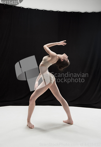 Image of Young teen dancer on white floor background.