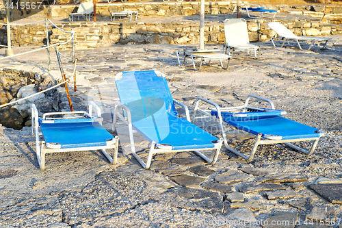 Image of Deck chairs on a sandy beach