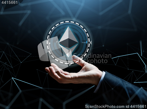 Image of businessman hand with ethereum over binary code