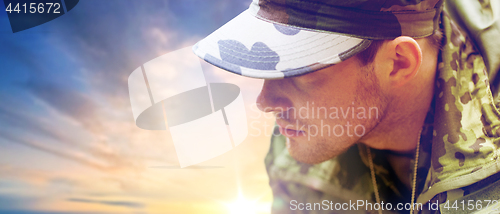 Image of close up of young soldier in military uniform