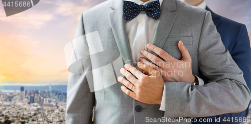 Image of close up of male gay couple over san francisco