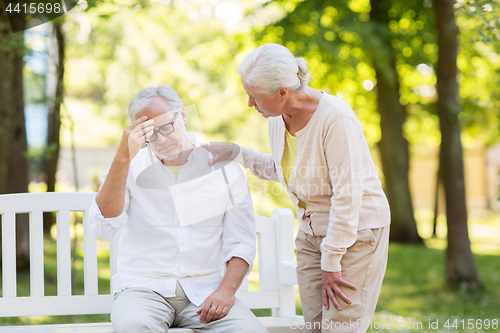 Image of senior man suffering from headache outdoors