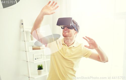 Image of young man in virtual reality headset or 3d glasses