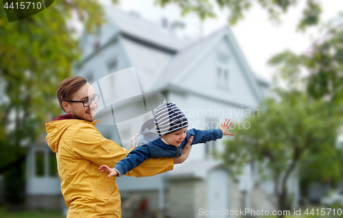 Image of father with son playing and having fun outdoors