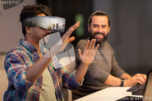 Image of developers with virtual reality headset at office