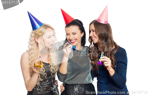 Image of happy women with party caps hugging