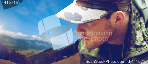 Image of close up of young soldier in military uniform