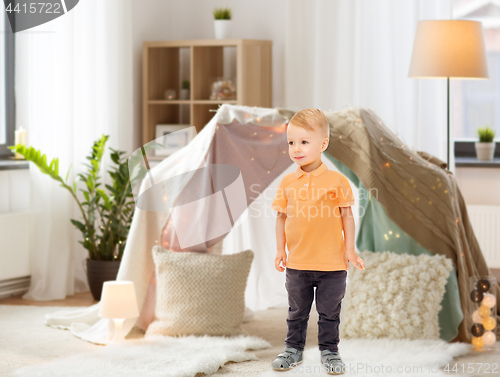 Image of happy little boy at home