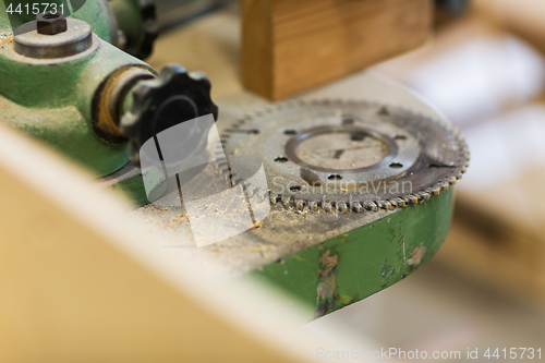 Image of cogwheel of old machine at workshop