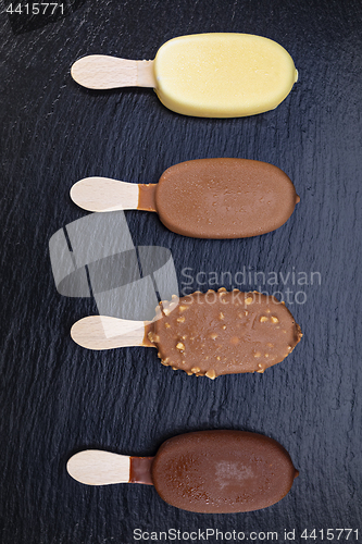 Image of Ice cream on stick covered with chocolate 