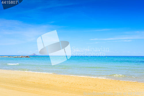 Image of European sandy beach and blue sea.