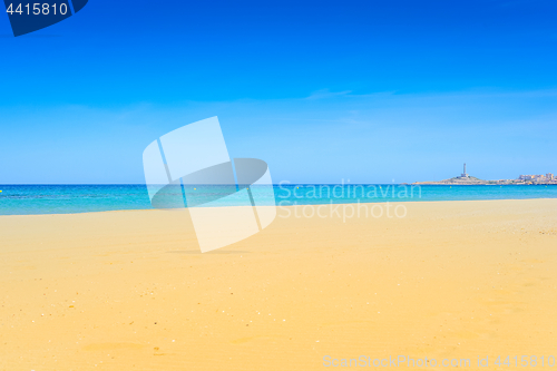 Image of European sandy beach and blue sea.