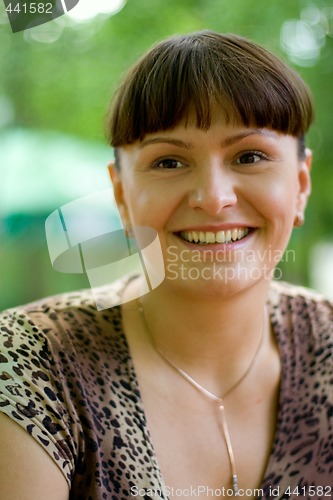 Image of smiling brunet woman
