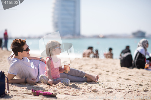 Image of Mom and daughter on the beach