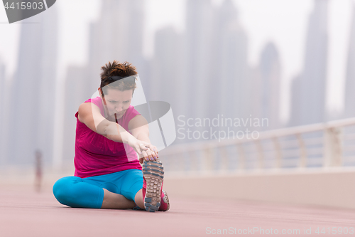 Image of woman stretching and warming up