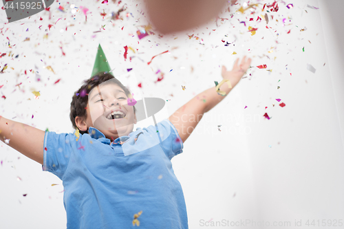 Image of kid blowing confetti