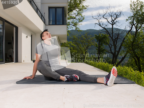 Image of man doing morning yoga exercises