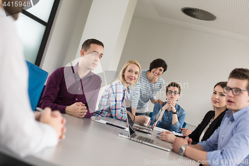 Image of Business Team At A Meeting at modern office building