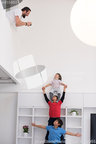 Image of young boys posing line up piggyback