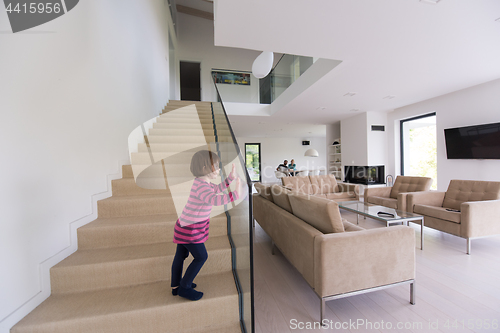 Image of family with little girl enjoys in the modern living room