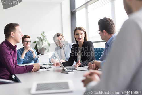 Image of Business Team At A Meeting at modern office building