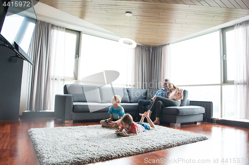 Image of couple spending time with kids