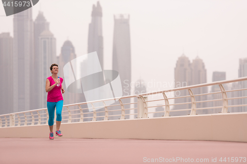 Image of woman running on the promenade