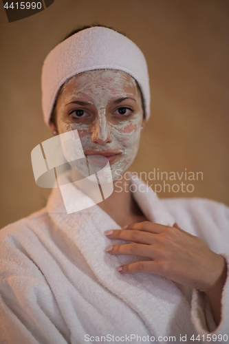 Image of Spa Woman applying Facial Mask