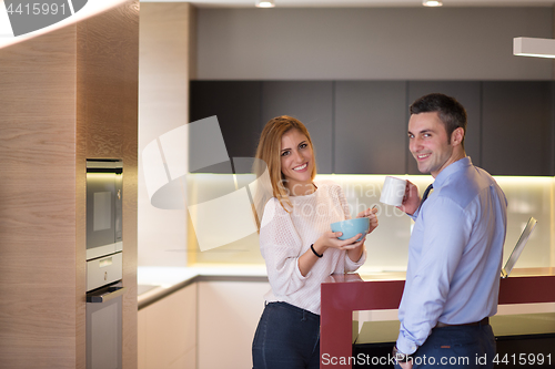 Image of A young couple is preparing for a job and using a laptop